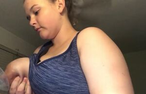 Buxom cow pumps milk from her enormous
